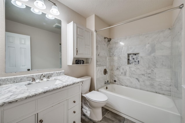 5072 Stanley Dr, The Colony, TX 75056 - full bathroom with toilet, tub / shower combination, vanity, and a textured ceiling