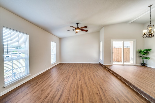 5072 Stanley Dr, The Colony, TX 75056 - spare room with plenty of natural light, wood finished floors, a chandelier, and baseboards