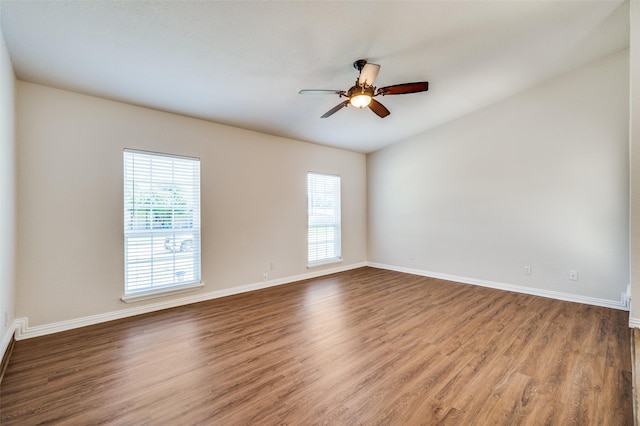 5072 Stanley Dr, The Colony, TX 75056 - empty room with ceiling fan, wood finished floors, and baseboards