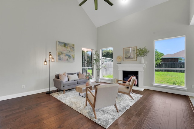 3925 Wisteria Ln, Haltom City, TX 76137 - living area featuring high vaulted ceiling, a fireplace with raised hearth, dark wood finished floors, and ceiling fan