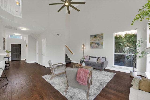 3925 Wisteria Ln, Haltom City, TX 76137 - living area featuring a high ceiling, stairs, a ceiling fan, and hardwood / wood-style flooring