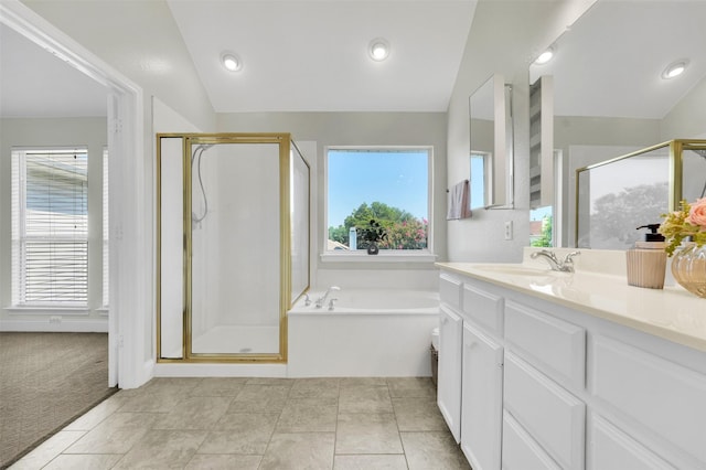 3925 Wisteria Ln, Haltom City, TX 76137 - bathroom with a garden tub, a stall shower, vanity, and vaulted ceiling