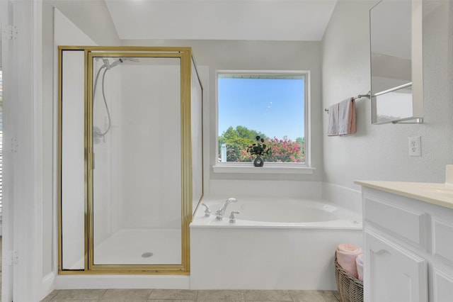 3925 Wisteria Ln, Haltom City, TX 76137 - full bathroom featuring vanity, a stall shower, a bath, and tile patterned floors