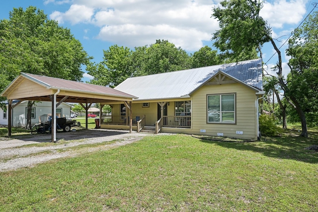 104 S Cedar St, Leonard, TX 75452 - view of front of home featuring driveway, a porch, a detached carport, a front yard, and metal roof