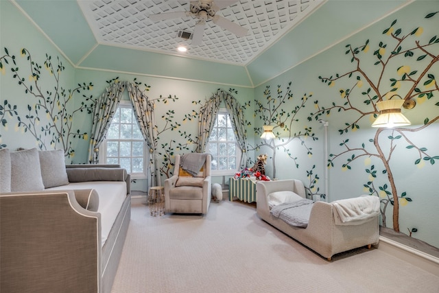 bedroom featuring crown molding, carpet flooring, a ceiling fan, baseboards, and a raised ceiling