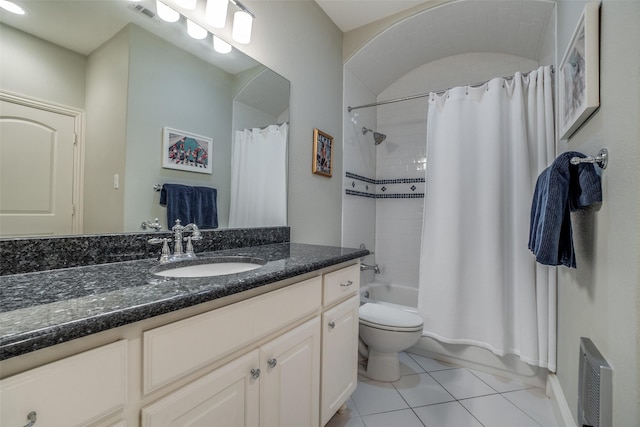 bathroom with tile patterned flooring, toilet, vanity, shower / bath combo with shower curtain, and baseboards