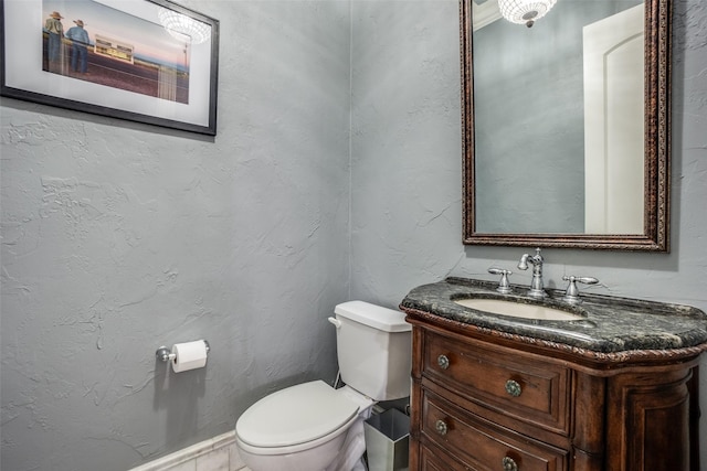 bathroom featuring toilet and vanity