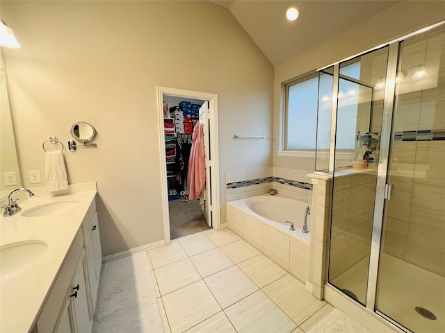 120 Black Alder Dr, Fort Worth, TX 76131 - bathroom with vaulted ceiling, a shower stall, a bath, tile patterned floors, and a spacious closet
