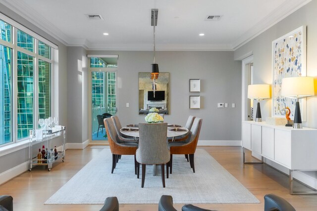 2525 N Pearl St Unit 1203, Dallas, TX 75201 - dining room featuring ornamental molding, light wood finished floors, baseboards, and recessed lighting