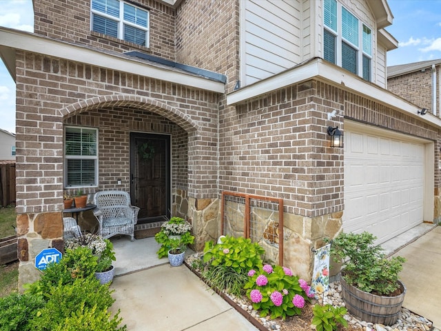 1359 Panorama Dr, Forney, TX 75126 - entrance to property featuring brick siding, a garage, and concrete driveway