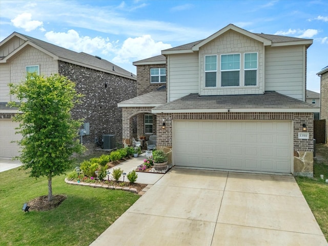 1359 Panorama Dr, Forney, TX 75126 - view of front of property with central AC, driveway, brick siding, an attached garage, and a front yard