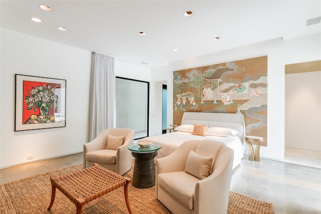 bedroom with finished concrete floors and recessed lighting