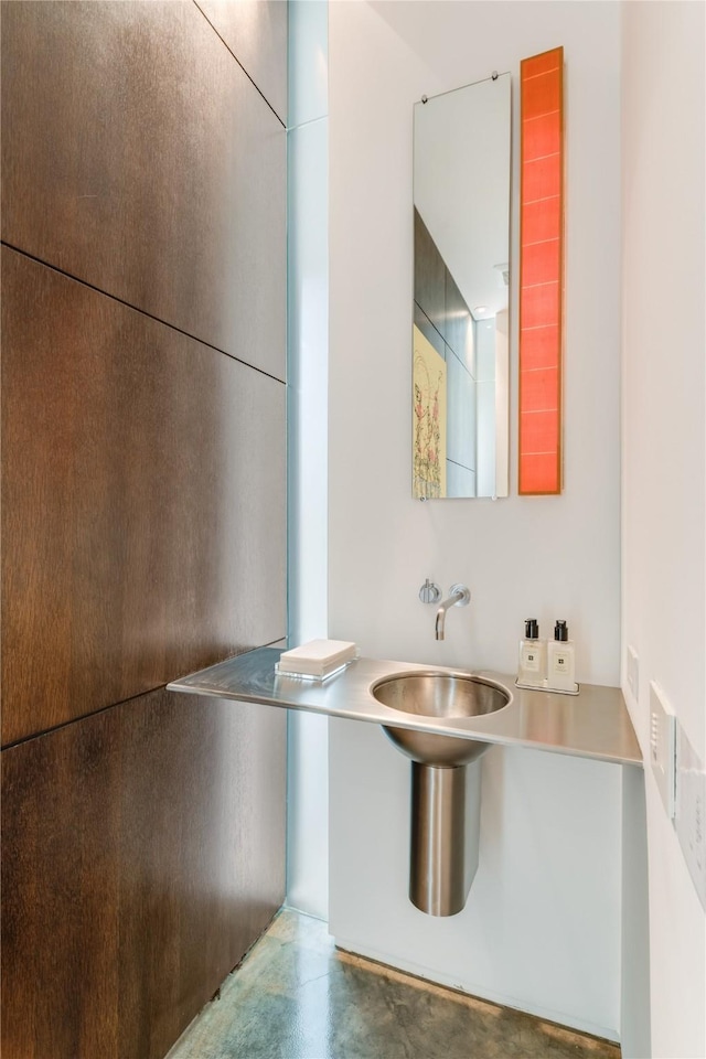 bathroom featuring concrete floors