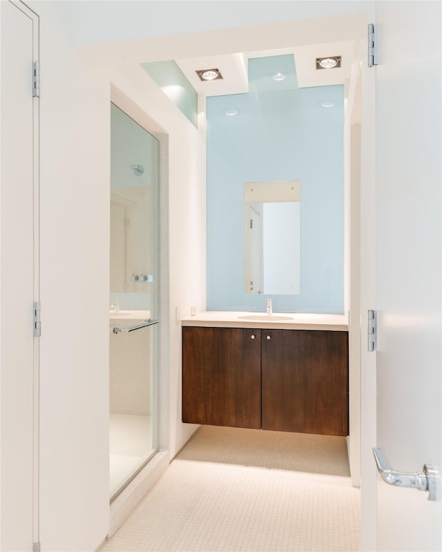 full bathroom featuring vanity and a stall shower