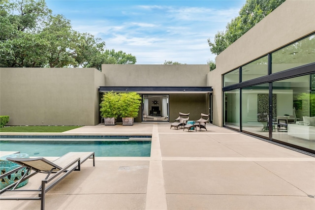 swimming pool featuring a patio area