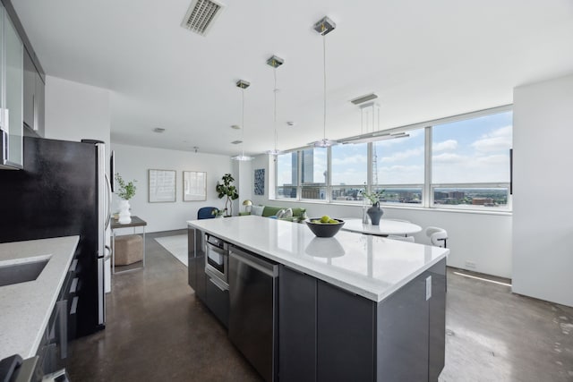 511 N Akard St Unit 1501, Dallas, TX 75201 - kitchen featuring modern cabinets, dark cabinets, decorative light fixtures, a kitchen island, and finished concrete floors