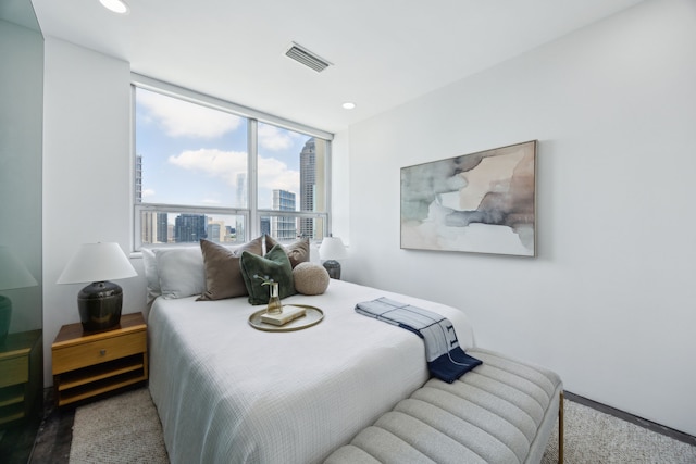 511 N Akard St Unit 1501, Dallas, TX 75201 - carpeted bedroom with a city view and recessed lighting