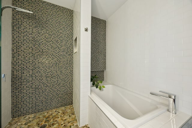 511 N Akard St Unit 1501, Dallas, TX 75201 - full bath with tile walls, tiled shower, and a garden tub