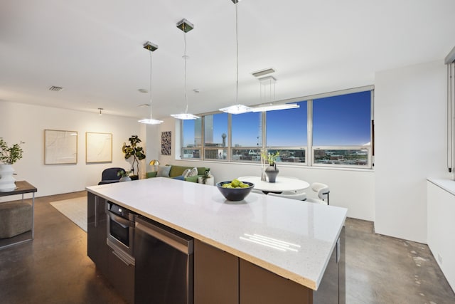 511 N Akard St Unit 1501, Dallas, TX 75201 - kitchen with concrete flooring, appliances with stainless steel finishes, decorative light fixtures, and healthy amount of natural light