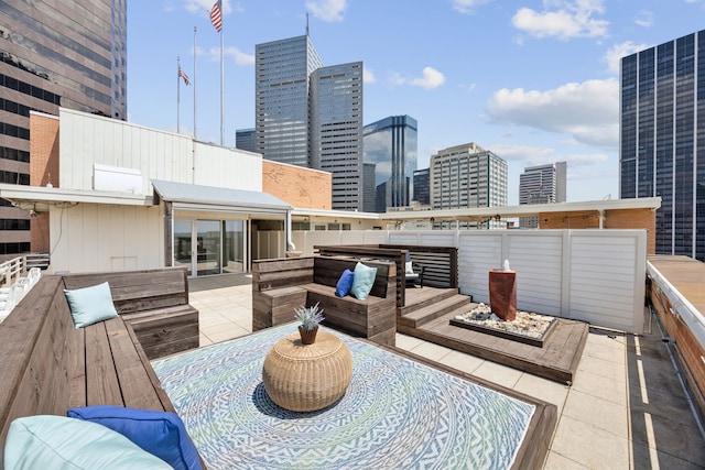 511 N Akard St Unit 1501, Dallas, TX 75201 - deck with a view of skyline, outdoor lounge area, and a patio area