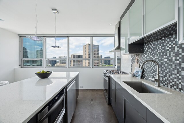 511 N Akard St Unit 1501, Dallas, TX 75201 - kitchen with a sink, stainless steel appliances, tasteful backsplash, a view of city, and light stone counters
