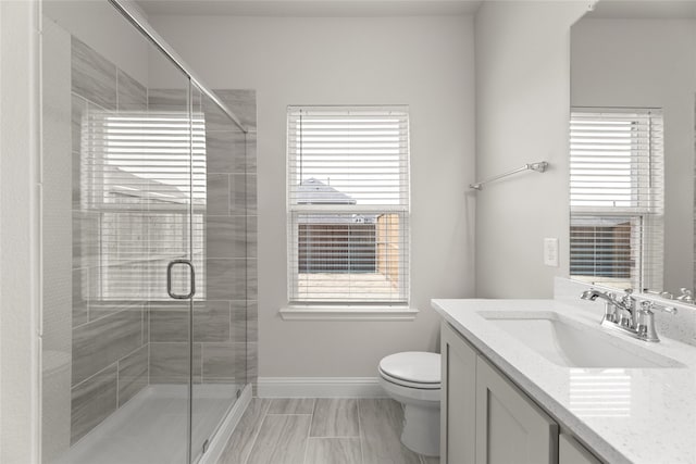 219 Griffith Dr, Princeton, TX 75407 - full bath featuring plenty of natural light, baseboards, vanity, and toilet