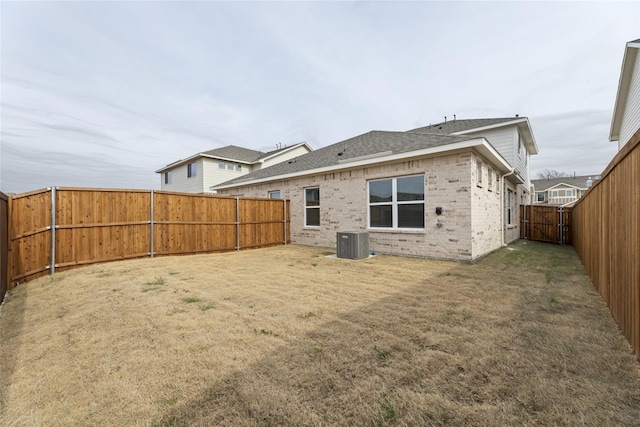 219 Griffith Dr, Princeton, TX 75407 - rear view of property featuring brick siding, central air condition unit, and roof with shingles