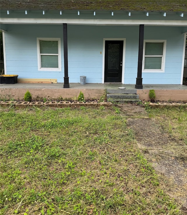 property entrance featuring a porch
