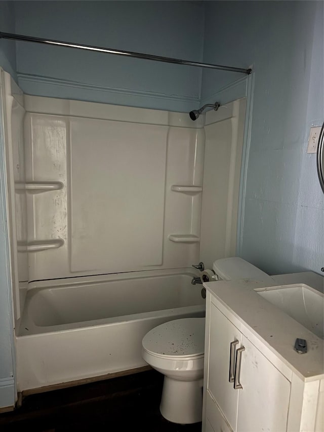 bathroom with shower / bathtub combination, toilet, and vanity