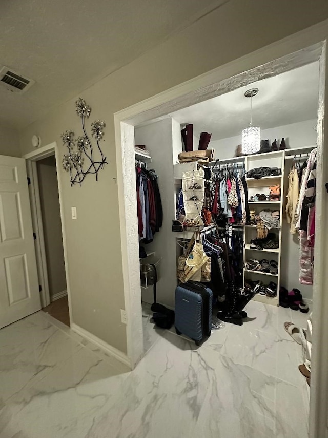 10125 Peppertree Ln, Fort Worth, TX 76108 - spacious closet featuring marble look tiles