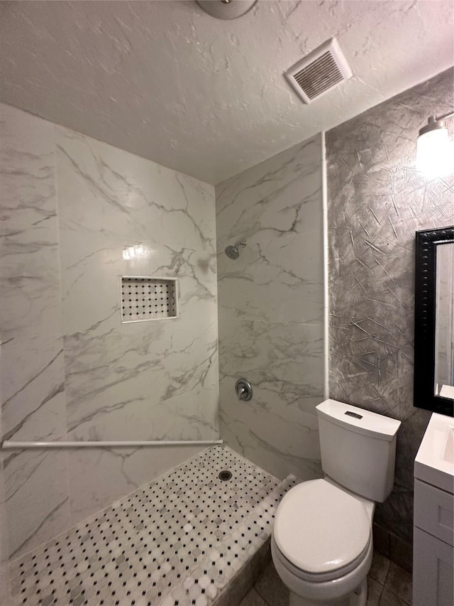 10125 Peppertree Ln, Fort Worth, TX 76108 - bathroom with a marble finish shower, toilet, and vanity