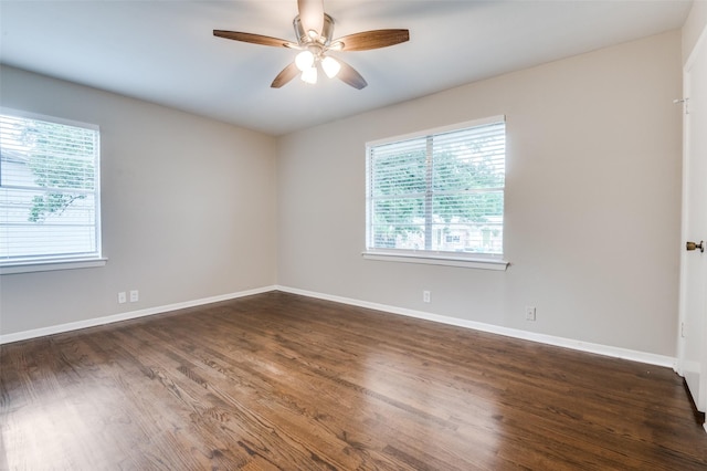 2018 Shawnee St, Denton, TX 76209 - spare room featuring healthy amount of natural light, a ceiling fan, wood finished floors, and baseboards