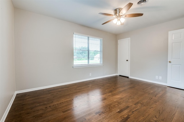 2018 Shawnee St, Denton, TX 76209 - unfurnished room with a ceiling fan, baseboards, and dark wood-style flooring