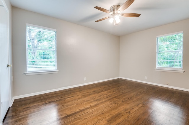 2018 Shawnee St, Denton, TX 76209 - spare room featuring a ceiling fan, dark wood-style flooring, and baseboards