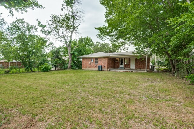 2018 Shawnee St, Denton, TX 76209 - view of yard featuring cooling unit and a patio area