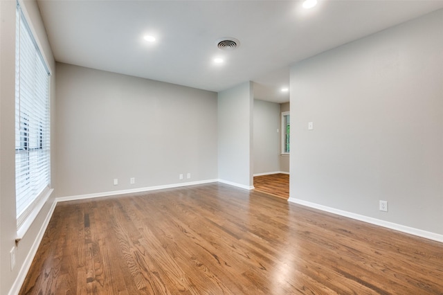 2018 Shawnee St, Denton, TX 76209 - spare room with wood finished floors, baseboards, plenty of natural light, and recessed lighting