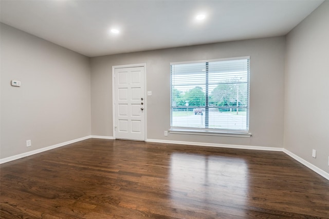 2018 Shawnee St, Denton, TX 76209 - unfurnished room with baseboards, wood finished floors, and recessed lighting