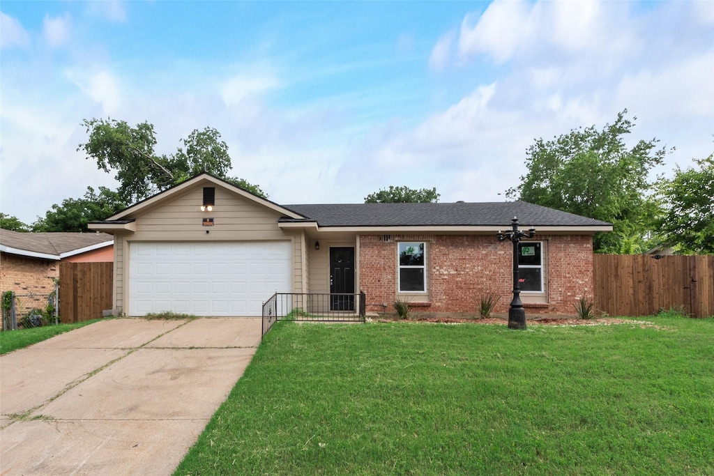 4505 Pecos St, Fort Worth, TX 76119 - view of front facade featuring driveway, an attached garage, and brick siding