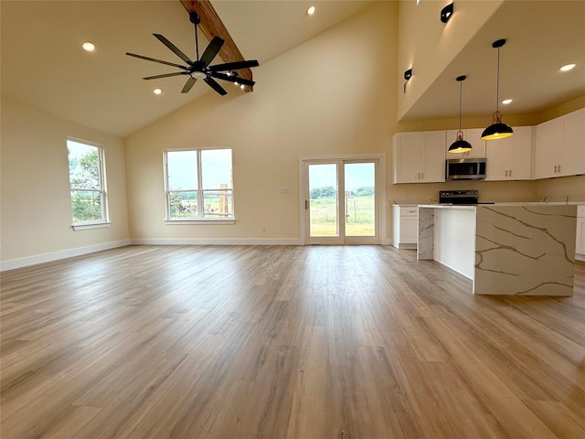5517 Stonegate Cir, Granbury, TX 76048 - unfurnished living room featuring high vaulted ceiling, ceiling fan, light wood-style floors, beam ceiling, and baseboards