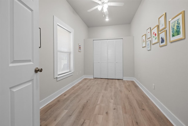 1461 Vz County Road 4607, Ben Wheeler, TX 75754 - unfurnished bedroom with light wood-style flooring, a closet, a ceiling fan, and baseboards