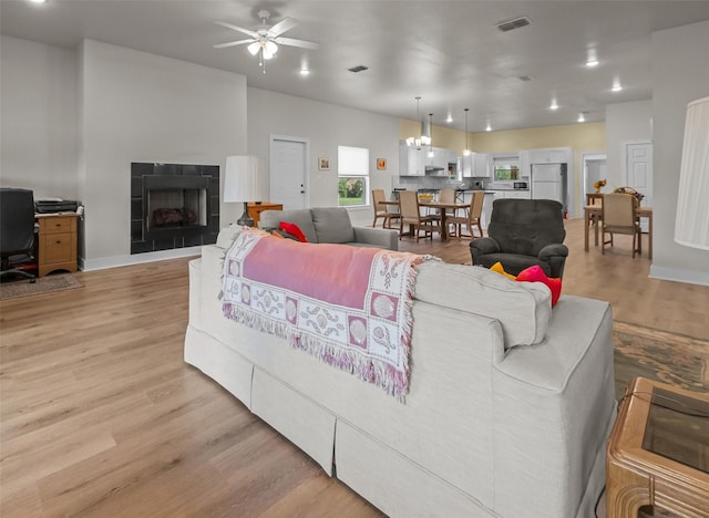 1461 Vz County Road 4607, Ben Wheeler, TX 75754 - living room with a ceiling fan, light wood finished floors, a tile fireplace, a desk, and recessed lighting