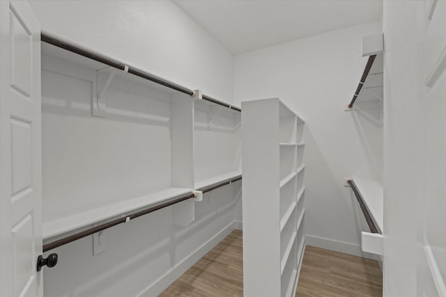 3725 Creek View Dr, Mckinney, TX 75071 - full bathroom featuring double vanity, wood finished floors, a spacious closet, recessed lighting, and baseboards