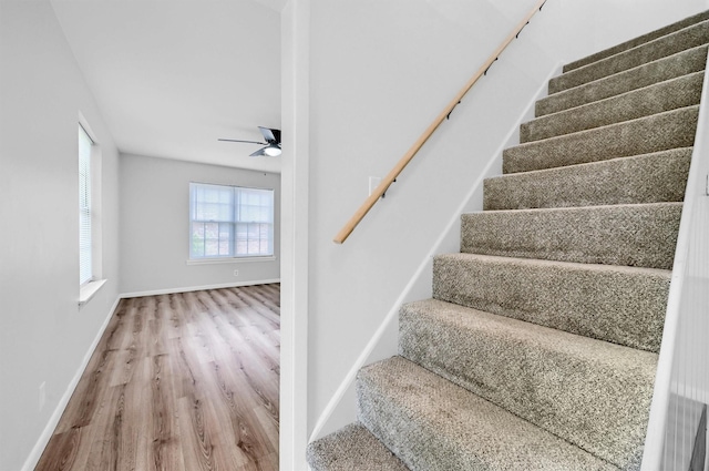 506 Melody Ln, Gainesville, TX 76240 - stairs with wood finished floors, ceiling fan, and baseboards