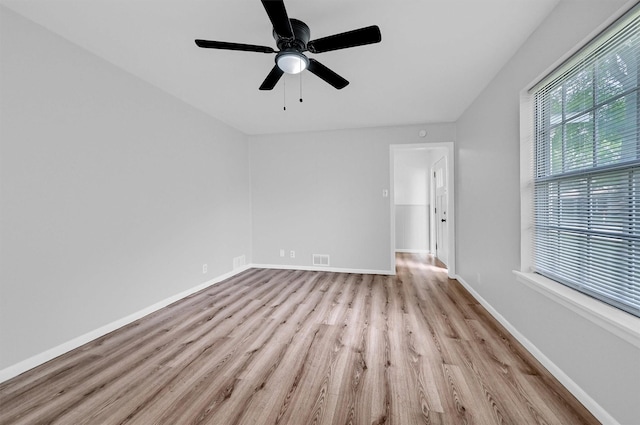 506 Melody Ln, Gainesville, TX 76240 - unfurnished room with wood finished floors, a ceiling fan, and baseboards