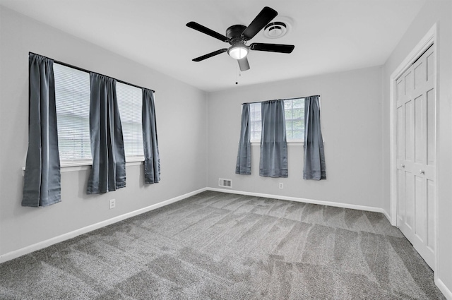 506 Melody Ln, Gainesville, TX 76240 - unfurnished bedroom with carpet floors, baseboards, a closet, and ceiling fan