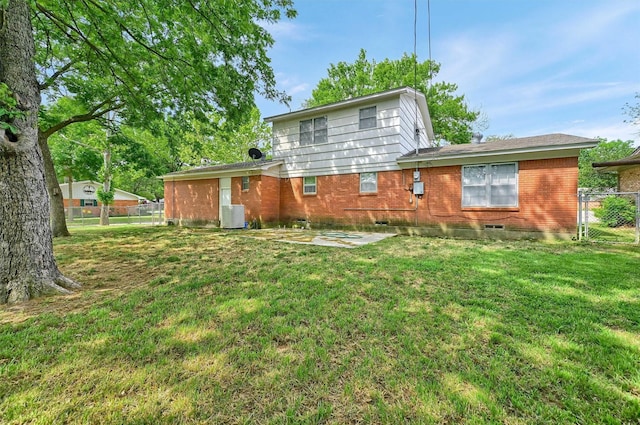 506 Melody Ln, Gainesville, TX 76240 - rear view of property with brick siding and central AC unit