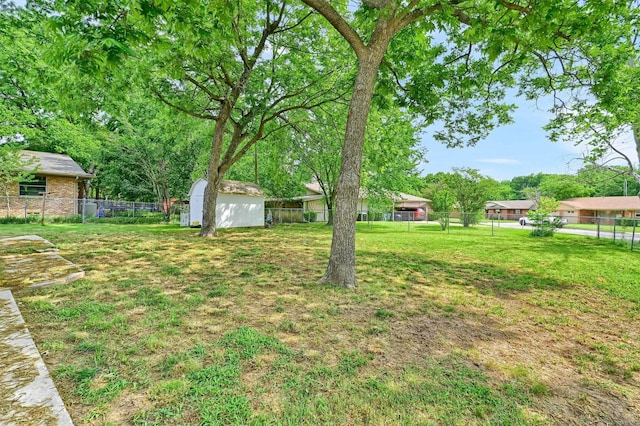 506 Melody Ln, Gainesville, TX 76240 - view of yard with a storage shed and an outdoor structure