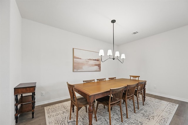 312 Duke Ct, Fate, TX 75189 - dining area featuring wood finished floors, a chandelier, and baseboards