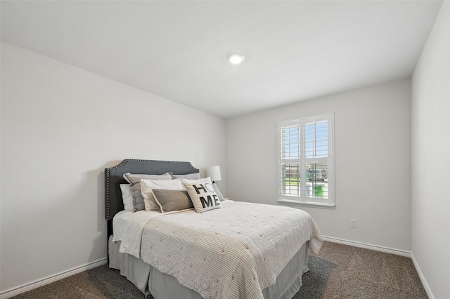 312 Duke Ct, Fate, TX 75189 - bedroom with dark carpet and baseboards