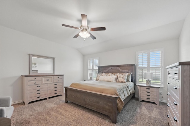 312 Duke Ct, Fate, TX 75189 - bedroom with multiple windows, carpet, vaulted ceiling, and a ceiling fan
